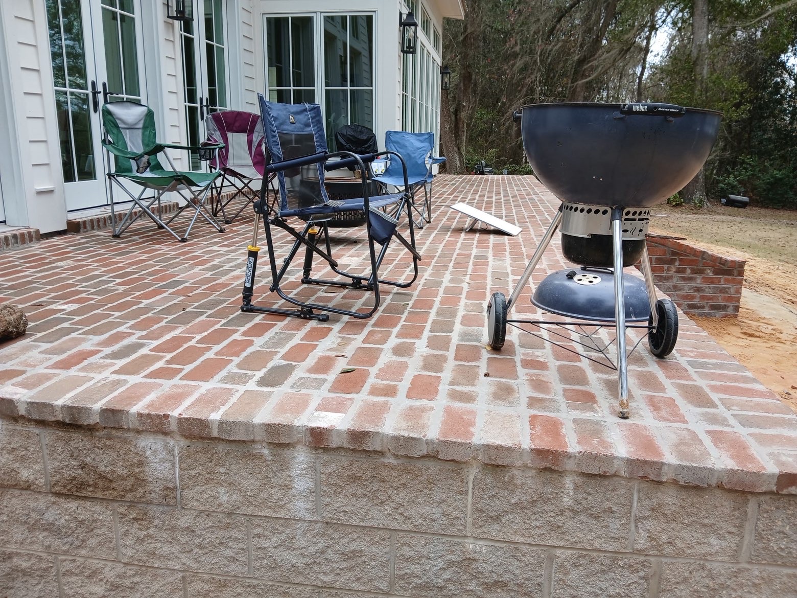 Patio surface with seating and grill
