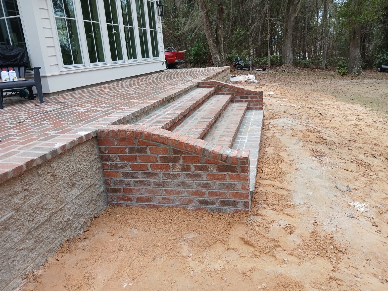 Brick steps leading down from the patio