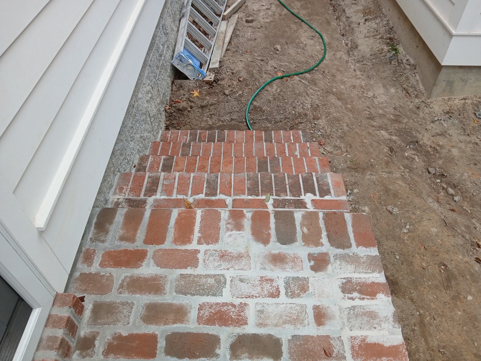 Detail of fresh brick step risers and treads