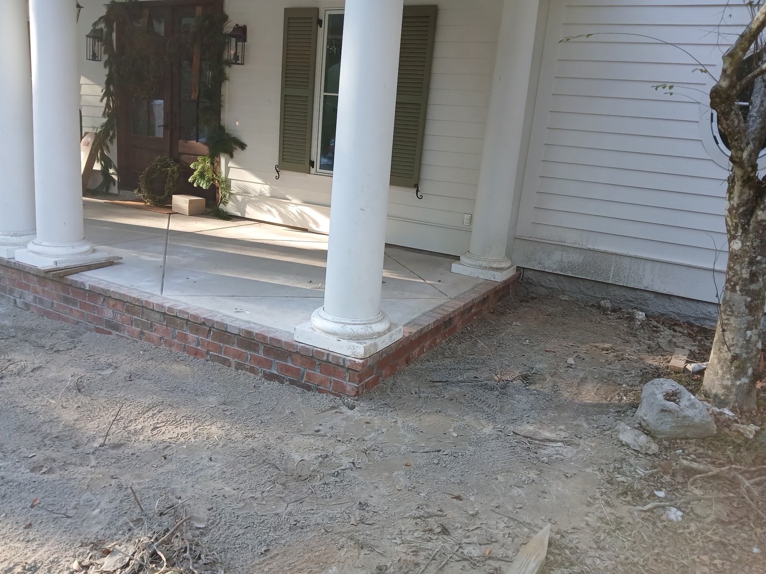 Corner detail of brick course meeting column base
