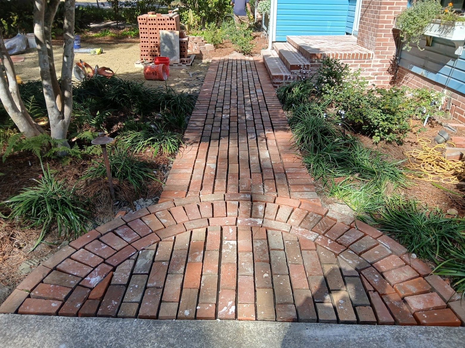 Finished reclaimed brick walkway with fan landing