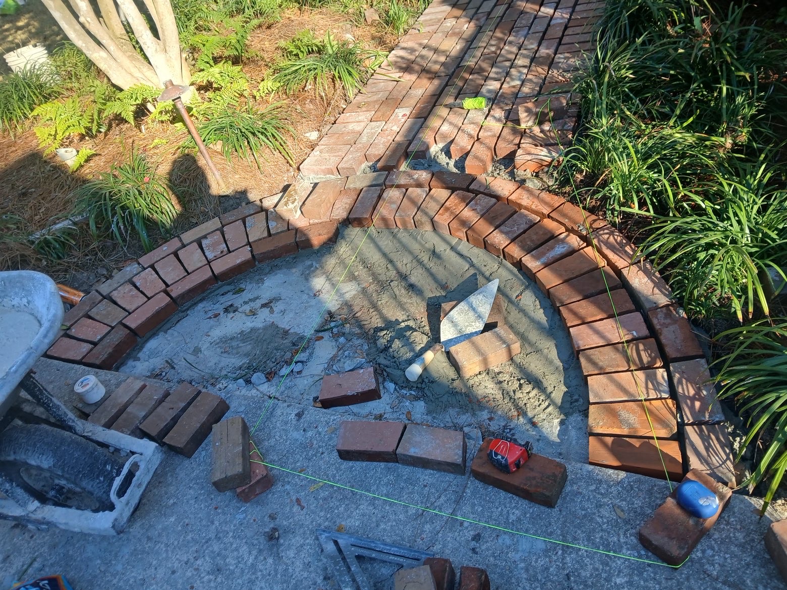 Brick fan being set with trowel and mortar